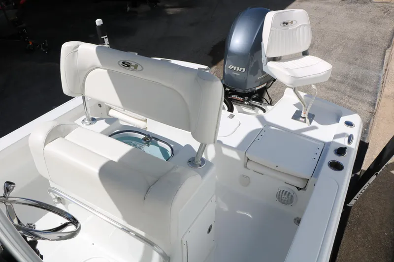 Slide: The Image of 2016 Sea Hunt BX 22 BR boat interior with Yamaha 200 engine and seating. - 40