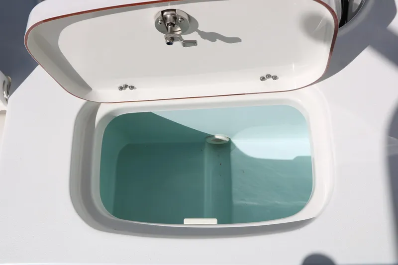 Slide: The Image of Open storage compartment on a 2016 Sea Hunt BX 22 BR boat. - 45