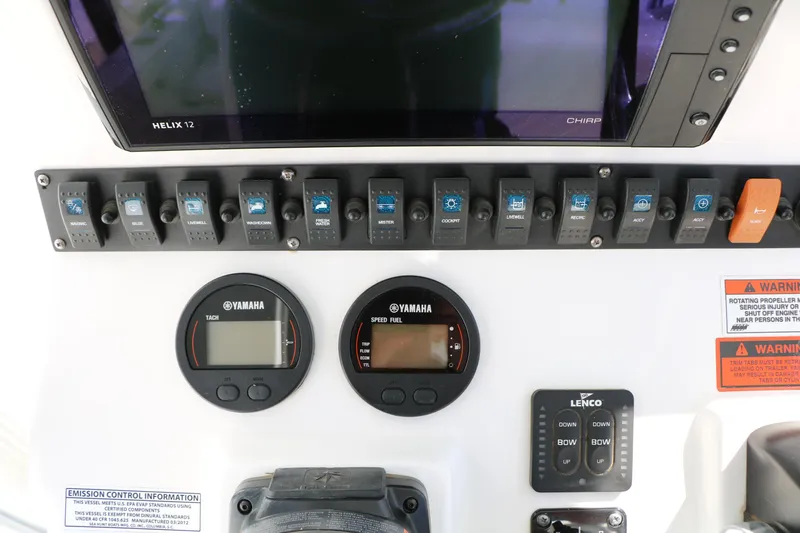 Slide: The Image of Control panel of a 2016 Sea Hunt BX 22 BR boat with Yamaha gauges and switches. - 49