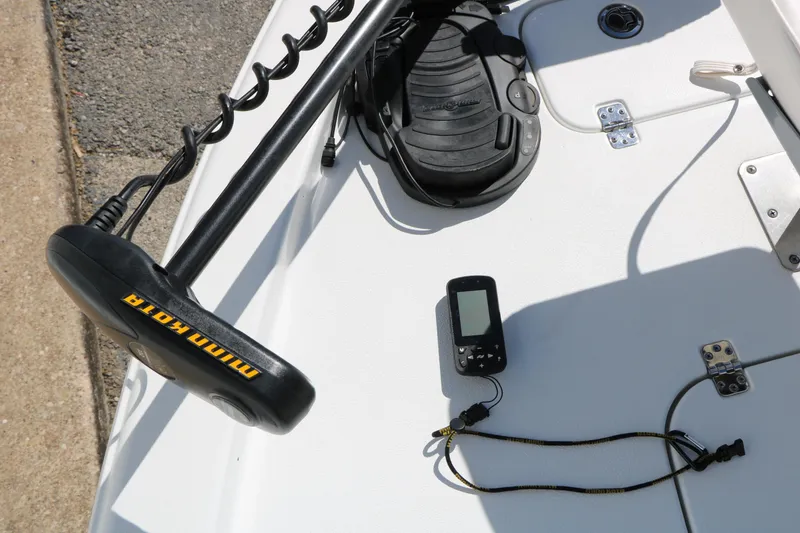 Slide: The Image of 2016 Sea Hunt BX 22 BR boat deck with Minn Kota trolling motor and GPS device. - 54