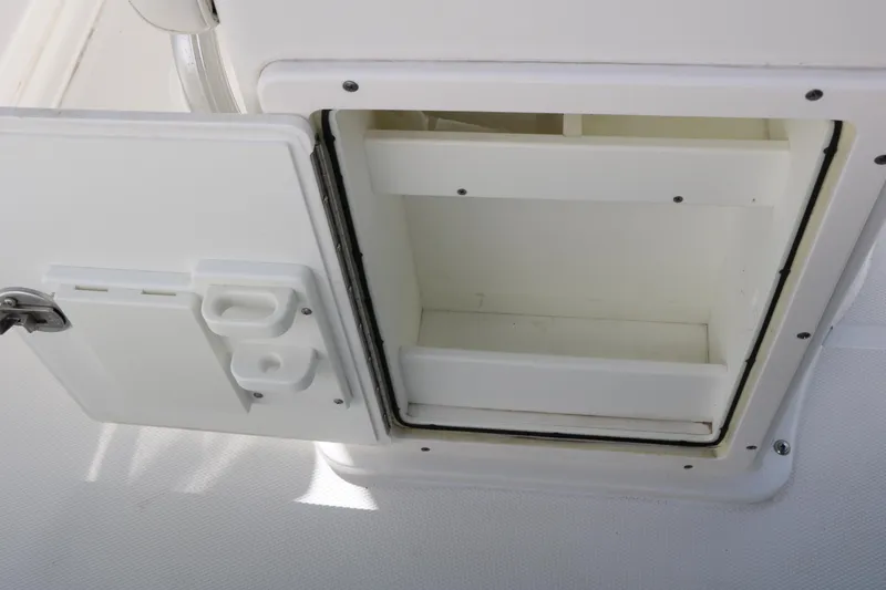 Slide: The Image of Open storage compartment on a 2016 Sea Hunt BX 22 BR boat. - 55