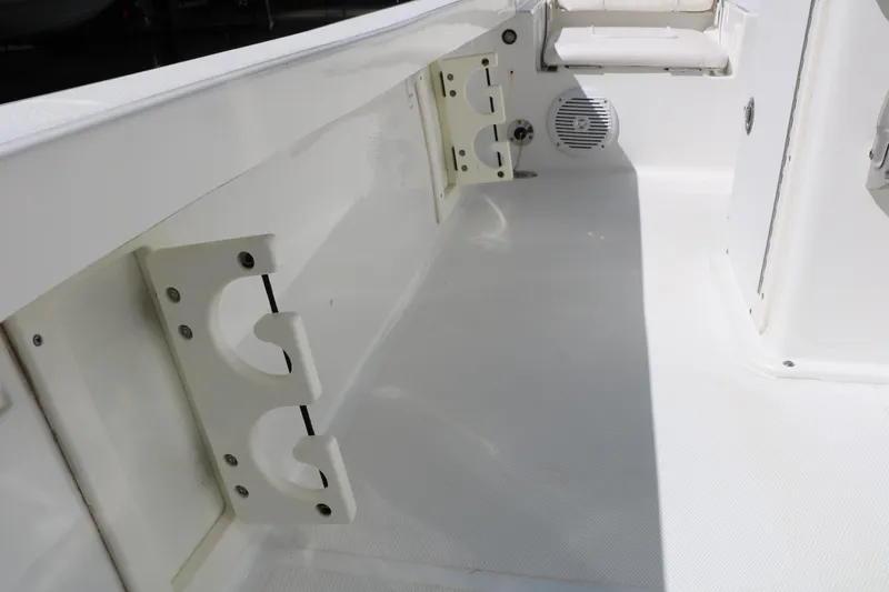 Slide: The Image of 2016 Sea Hunt BX 22 BR boat interior with rod holders and speaker. - 57