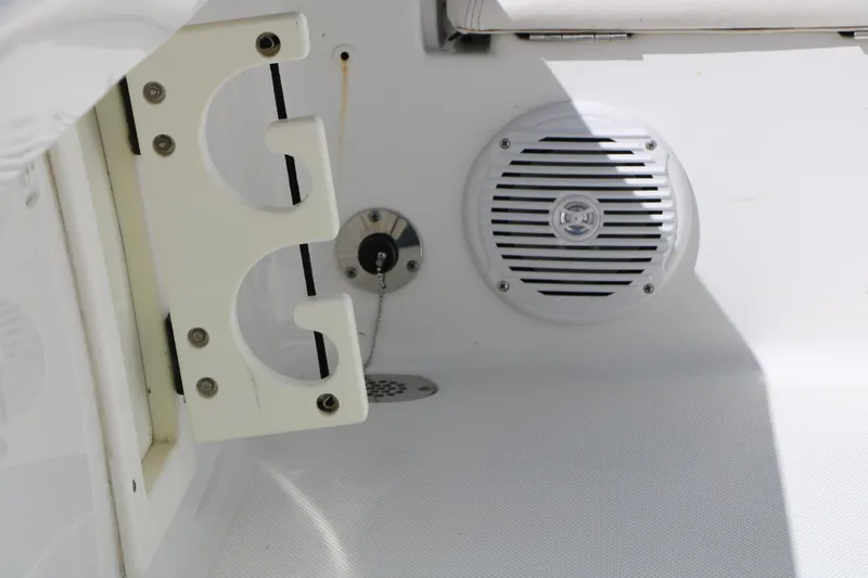 Slide: The Image of 2016 Sea Hunt BX 22 BR boat interior with cup holder and speaker. - 58