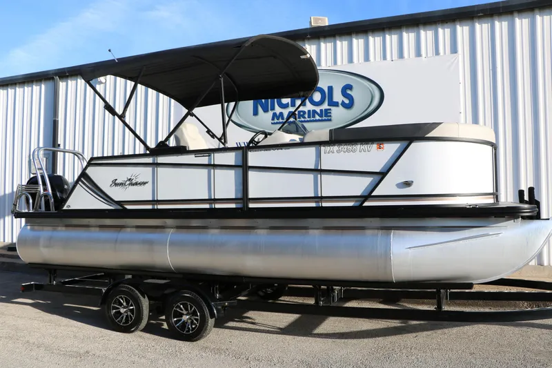 The Image of 2024 Sun Chaser Geneva SB DH pontoon boat on trailer at Nichols Marine. - 1