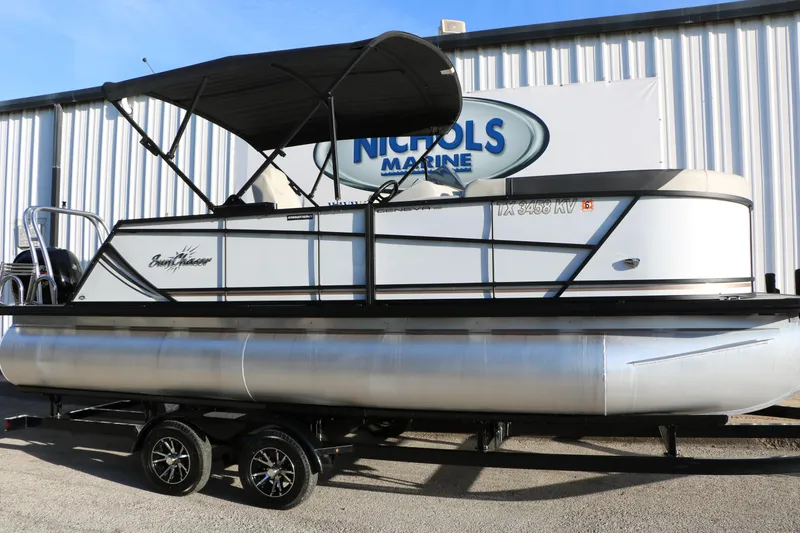 Slide: The Image of 2024 Sun Chaser Geneva SB DH pontoon boat with canopy on trailer at Nichols Marine. - 11