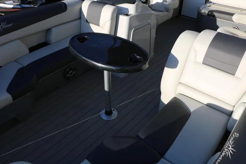 Slide: The Image of 2024 Sun Chaser Geneva SB DH boat interior with seating and a central table. - 18