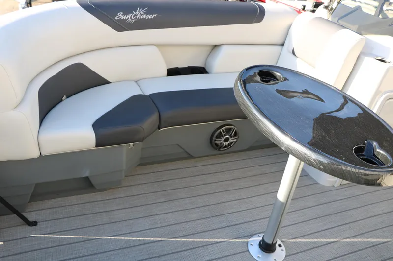 Slide: The Image of 2024 Sun Chaser Geneva SB DH boat interior with cushioned seating and table. - 19
