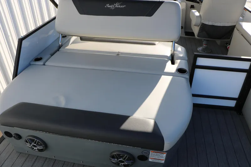 Slide: The Image of 2024 Sun Chaser Geneva SB DH boat interior with seating and cup holders. - 20