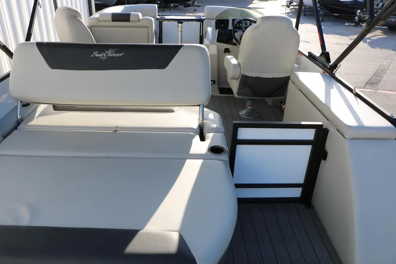Slide: The Image of 2024 Sun Chaser Geneva SB DH boat interior with seating and helm. - 21