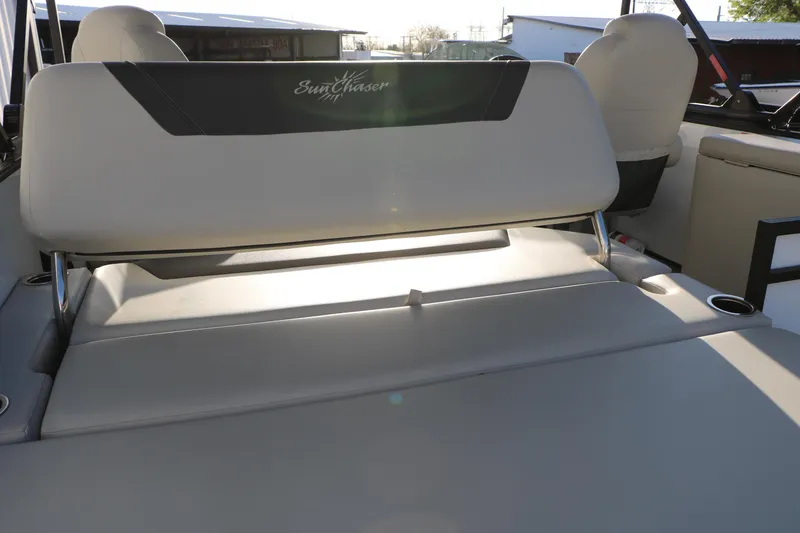 Slide: The Image of 2024 Sun Chaser Geneva SB DH boat interior with comfortable seating and cup holders. - 22