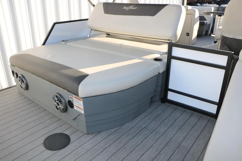 Slide: The Image of 2024 Sun Chaser Geneva SB DH boat interior with seating and speakers. - 24