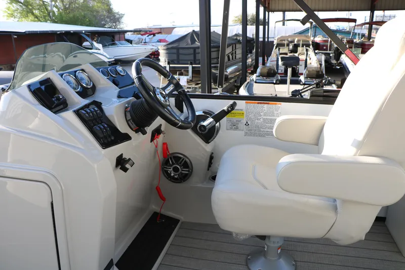 Slide: The Image of 2024 Sun Chaser Geneva SB DH boat helm with steering wheel and captain's chair. - 26