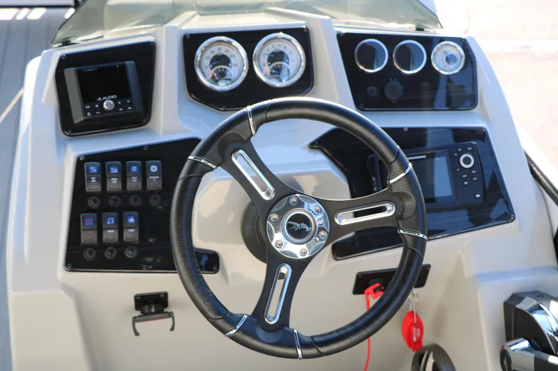 Slide: The Image of Steering console of 2024 Sun Chaser Geneva SB DH boat with modern controls and gauges. - 29