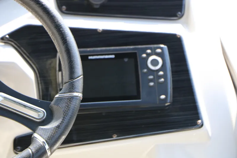 Slide: The Image of Steering wheel and control panel of 2024 SunChaser Geneva SB DH boat. - 33