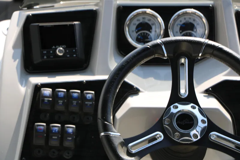 Slide: The Image of 2024 SunChaser Geneva SB DH dashboard with steering wheel and control panel. - 34