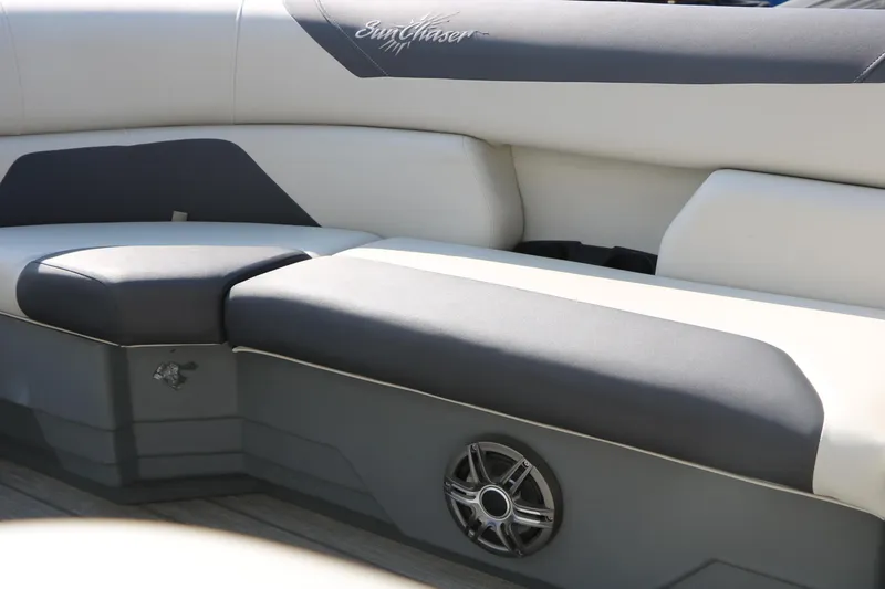 Slide: The Image of 2024 SunChaser Geneva SB DH boat interior with cushioned seating and speaker. - 35