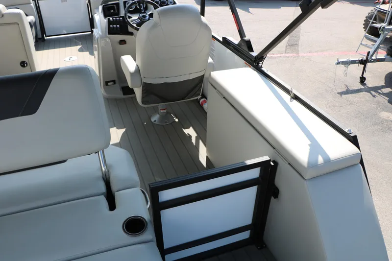 Slide: The Image of Interior of 2024 SunChaser Geneva SB DH boat, featuring modern seating and steering console. - 36