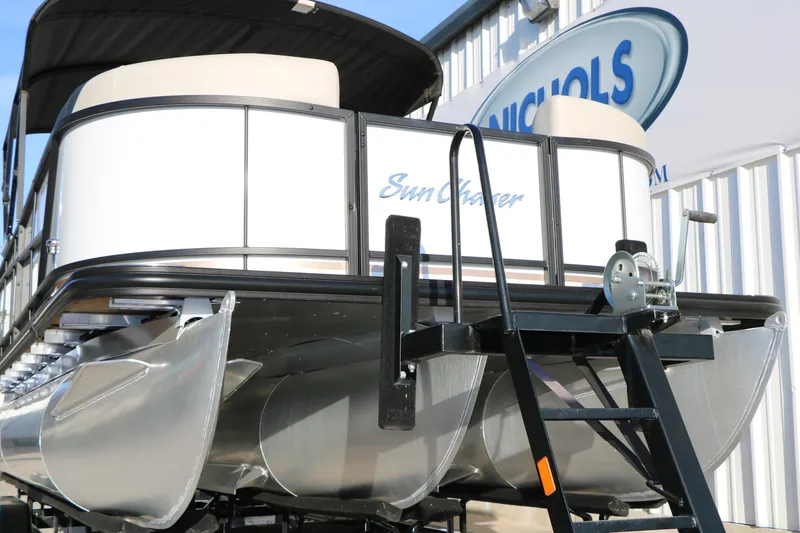 Slide: The Image of 2024 Sun Chaser Geneva SB DH pontoon boat, rear view with ladder and logo. - 4