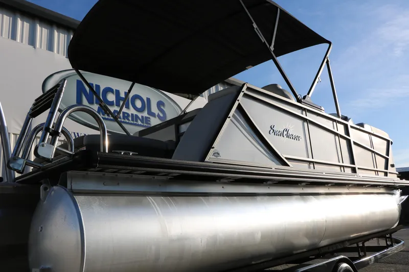 Slide: The Image of 2024 Sun Chaser Geneva SB DH pontoon boat at Nichols Marine dealership. - 6