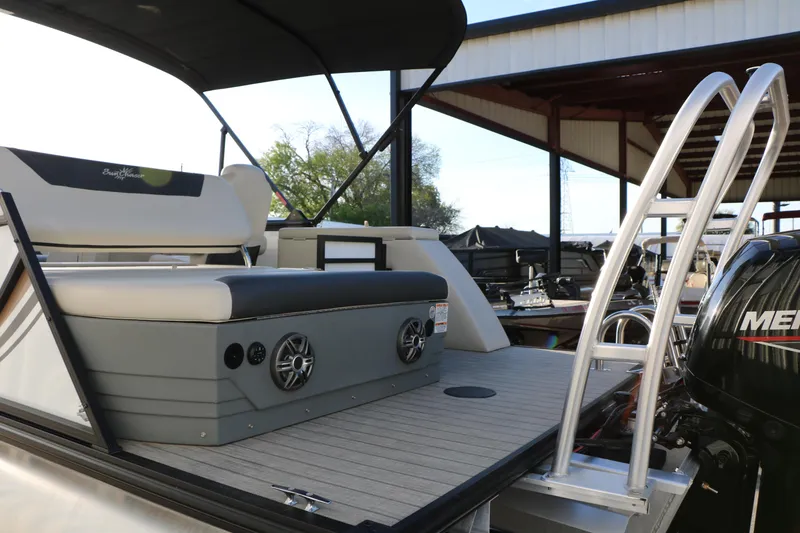 Slide: The Image of 2024 Sun Chaser Geneva SB DH boat with seating and Mercury engine at a marina. - 7