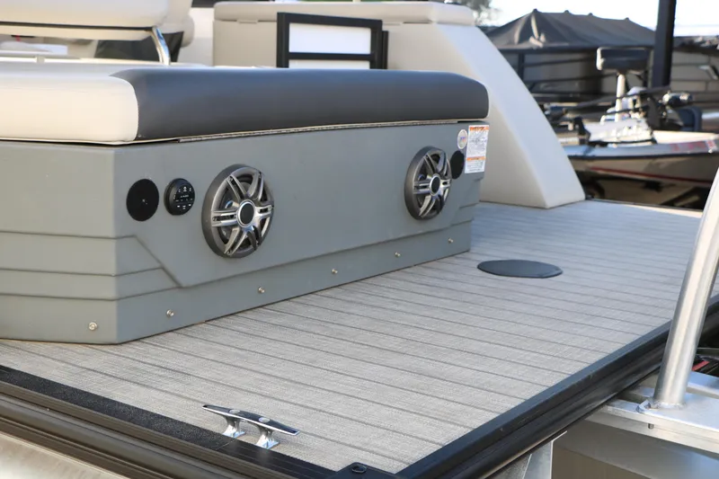 Slide: The Image of 2024 Sun Chaser Geneva SB DH boat deck with speakers and seating. - 8
