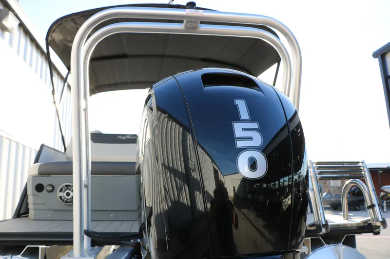Slide: The Image of 2024 Sun Chaser Geneva SB DH boat with 150 horsepower engine, rear view. - 9