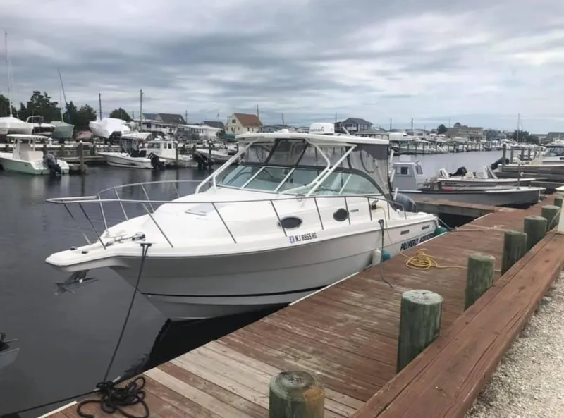 Slide: The Image of 2015 Wellcraft 290 Coastal boat docked at marina. - 0