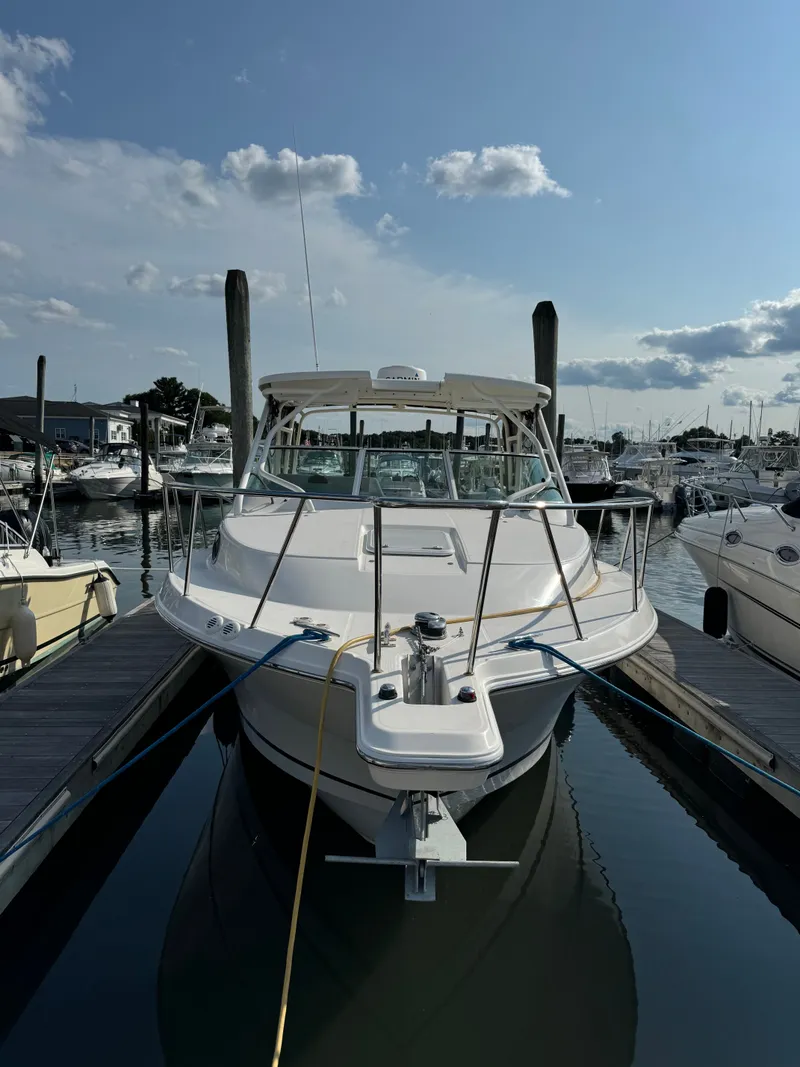 Slide: The Image of 2015 Wellcraft 290 Coastal boat docked in marina. - 1