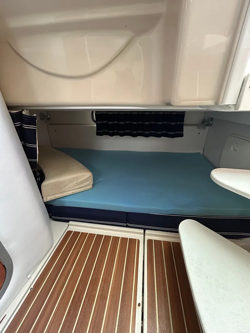 Slide: The Image of Interior of 2015 Wellcraft 290 Coastal with sleeping area. - 16