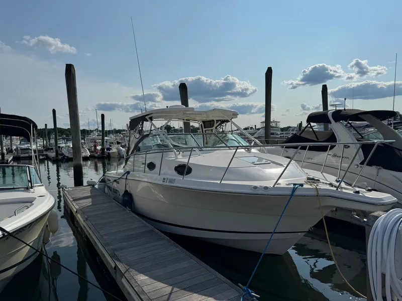 Slide: The Image of 2015 Wellcraft 290 Coastal boat docked at marina. - 2