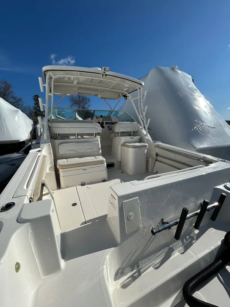 Slide: The Image of 2015 Wellcraft 290 Coastal boat interior under sunny skies. - 7