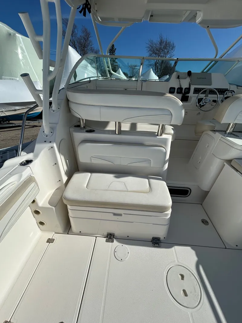 Slide: The Image of Interior of a 2015 Wellcraft 290 Coastal boat with white seating. - 8