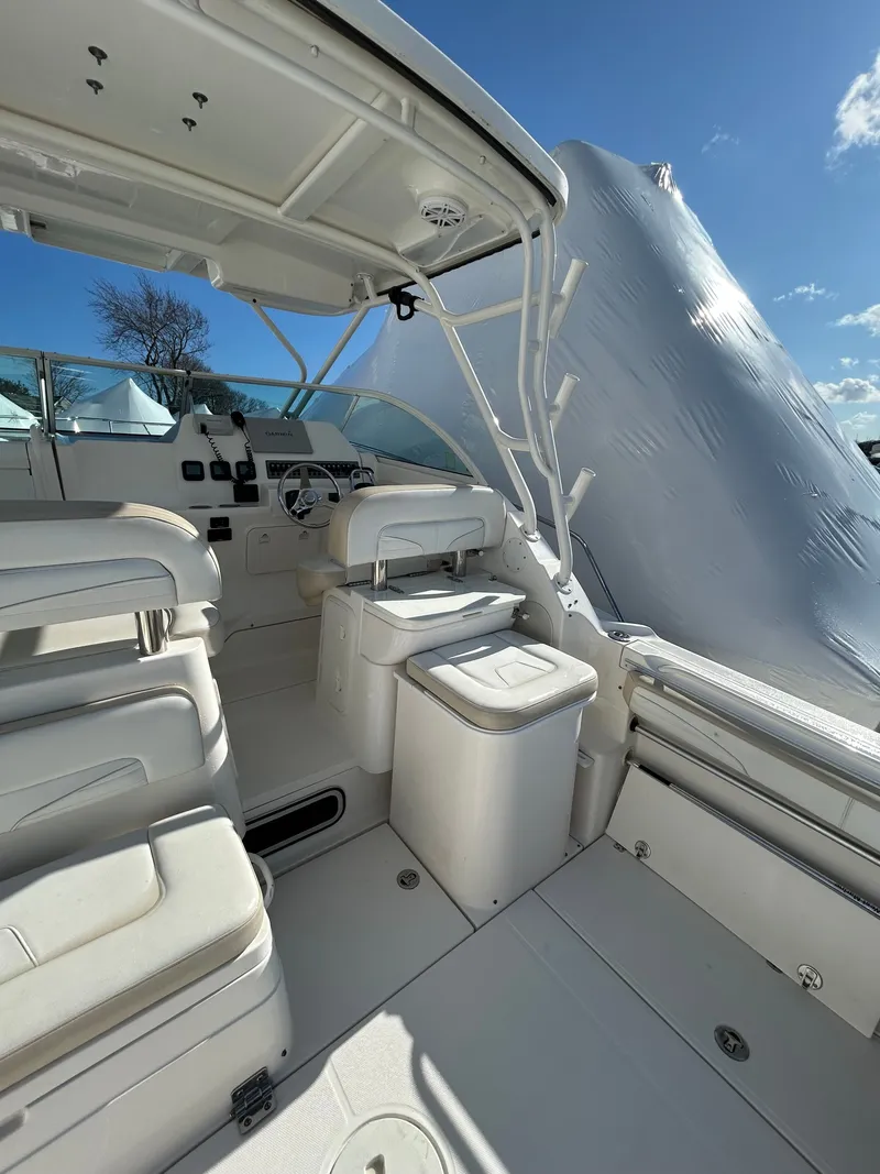 Slide: The Image of Interior of 2015 Wellcraft 290 Coastal with seating and helm station. - 9