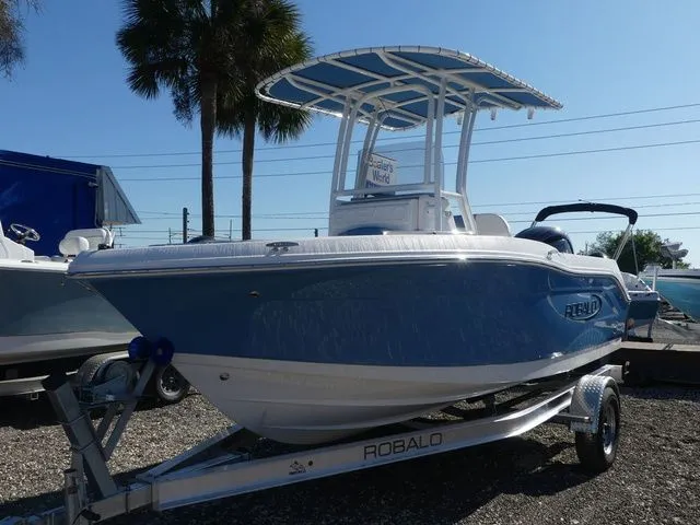 The Image of 2026 Robalo R180 Center Console boat on trailer. - 1