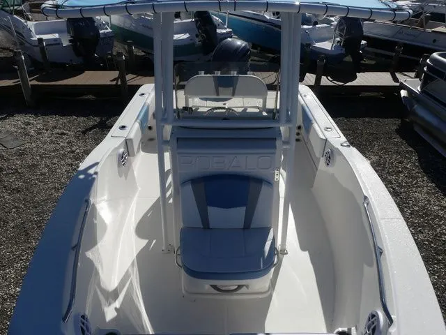 Slide: The Image of 2026 Robalo R180 Center Console boat at a dock. - 13