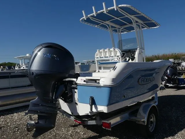 Slide: The Image of 2026 Robalo R180 Center Console boat with outboard motor. - 4