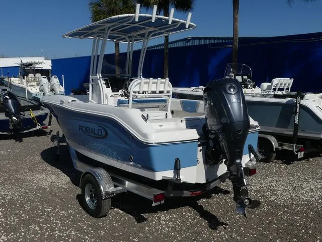 Slide: The Image of 2026 Robalo R180 Center Console boat on trailer. - 6