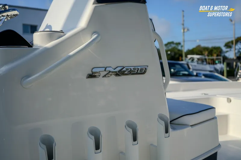 Slide: The Image of 2026 Skeeter SX230 boat detail with logo, showcased at Boat & Motor Superstores. - 14