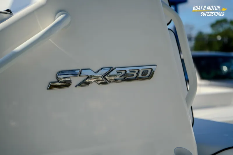Slide: The Image of 2026 Skeeter SX230 boat emblem on white surface, showcasing sleek design. - 15