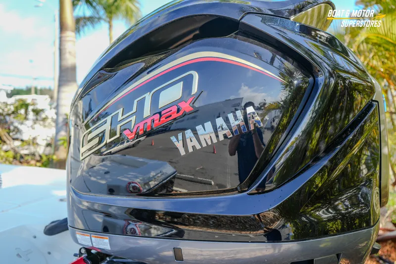 Slide: The Image of Yamaha SHO VMAX engine on a 2026 Skeeter SX230 boat, outdoors with palm trees. - 19
