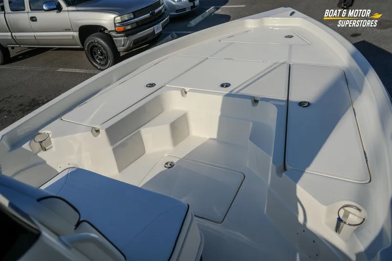 Slide: The Image of 2026 Skeeter SX230 boat interior with seating and storage compartments. - 23
