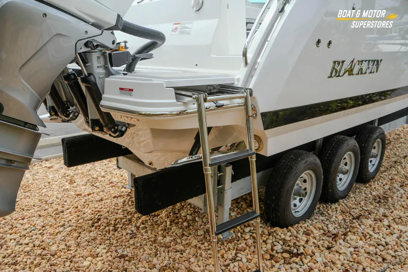 Slide: The Image of 2026 Blackfin 272 DC boat on trailer with ladder and outboard motor. - 10