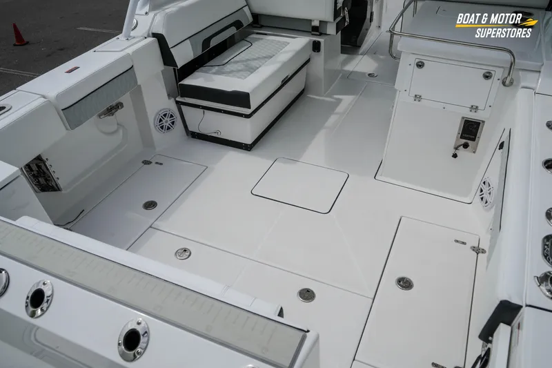 Slide: The Image of 2026 Blackfin 272 DC boat interior with spacious seating and modern amenities. - 16