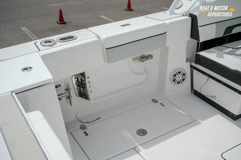 Slide: The Image of Interior of 2026 Blackfin 272 DC boat, featuring seating and storage compartments. - 18