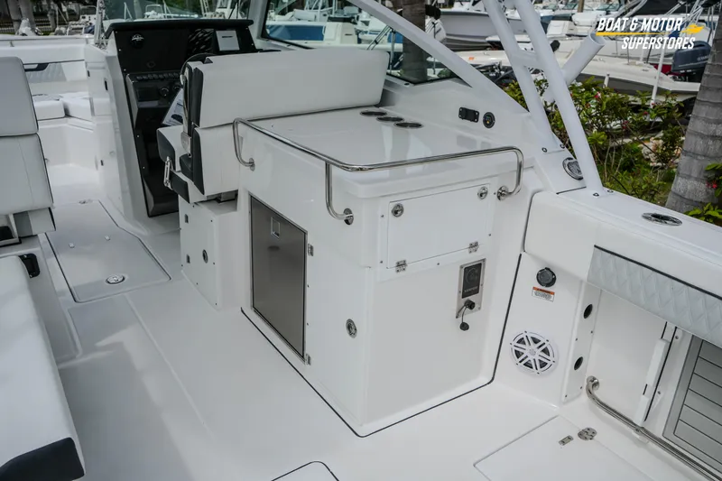 Slide: The Image of 2026 Blackfin 272 DC boat interior with seating and storage compartments. - 20