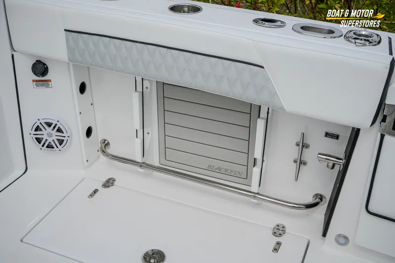 Slide: The Image of 2026 Blackfin 272 DC boat interior with storage compartment and speaker. - 22