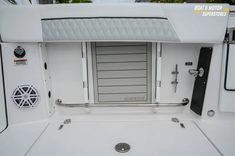 Slide: The Image of 2026 Blackfin 272 DC boat interior with speaker and storage compartment. - 23