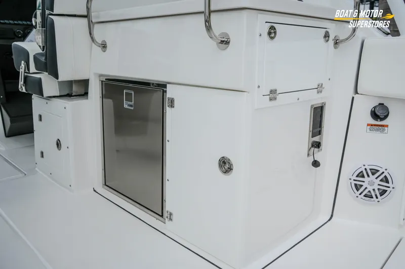 Slide: The Image of 2026 Blackfin 272 DC boat interior with storage compartments and seating. - 24