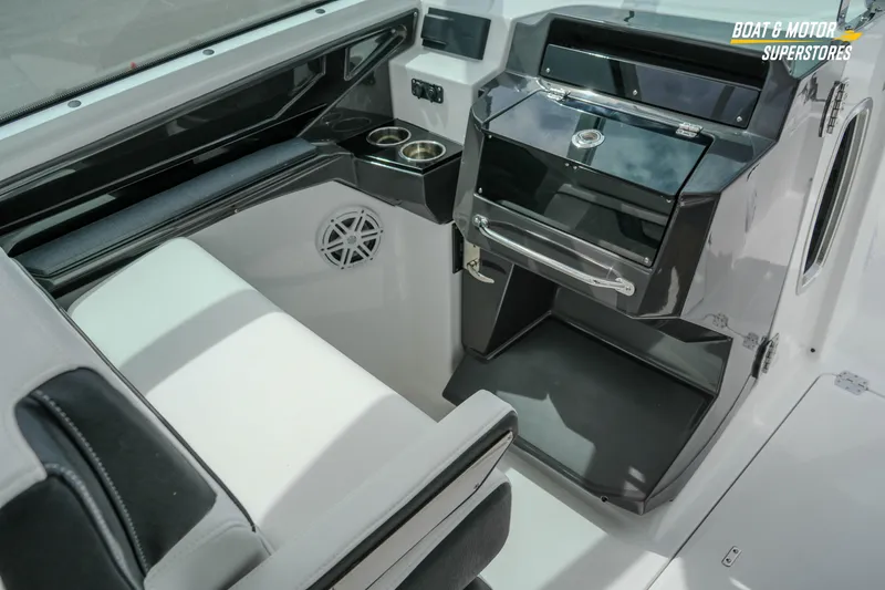 Slide: The Image of 2026 Blackfin 272 DC boat interior with seating, storage, and cup holders. - 29