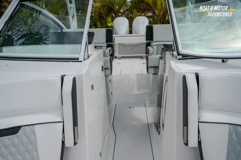Slide: The Image of 2026 Blackfin 272 DC boat interior with sleek white seating and modern design. - 38